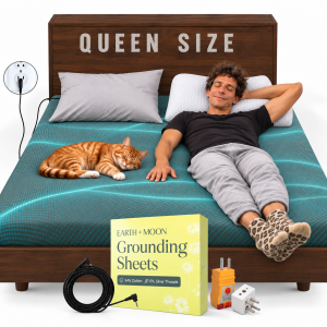 Photorealistic rendition of Joe Drummer Boy relaxing with eyes closed on a queen-size bed with teal Earth + Moon grounding sheets, one hand touching the sheets, wearing leopard-print ankle socks beside a sleeping orange tabby cat. Two white ergonomic pillows rest against a wooden headboard labeled “QUEEN SIZE.” In front of the bed are an “EARTH + MOON Grounding Sheets” box labeled “94% Cotton, 6% Silver Threads,” a grounding cord, outlet tester, and plug adapter, with a grounded electrical connection shown beside the bed.