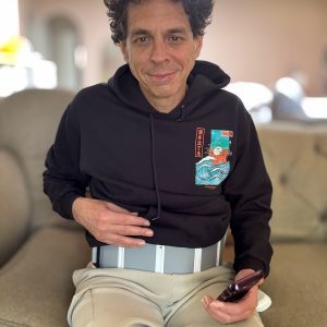 Joe using Red Light Therapy laser belt on his gut